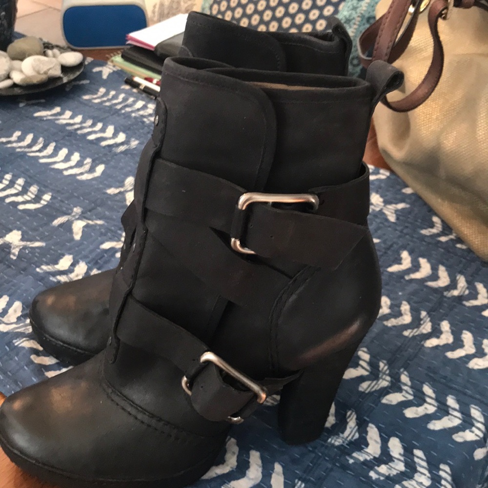 DKNY platform boots with buckled.